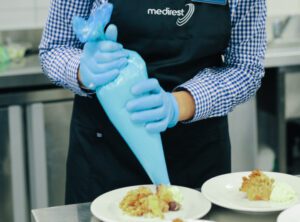 Employee making pastries